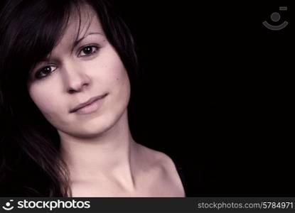 beautiful young woman portrait, isolated on black