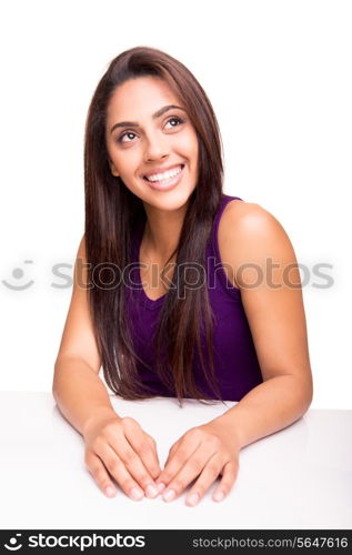 Beautiful young woman posing over white background