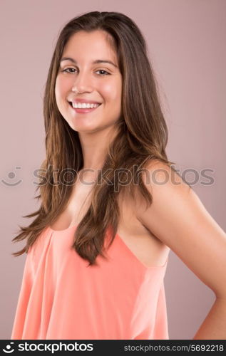 Beautiful young woman posing over white background