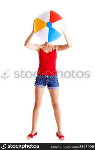 Beautiful young woman posing with a beach ball