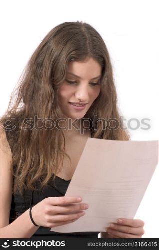 Beautiful young woman reading the mail with a happy face
