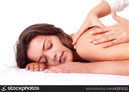 Beautiful young woman receiving a massage