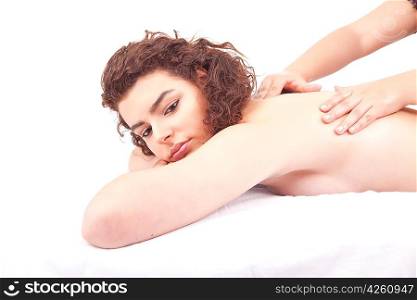 Beautiful young woman receiving a massage
