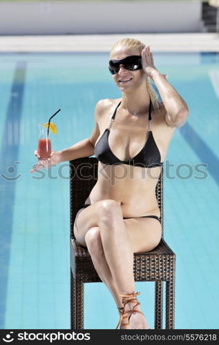 beautiful young woman relax and have fun at swimming pool