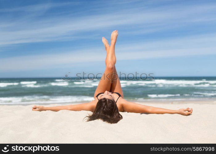 Beautiful young woman relaxing at the beach