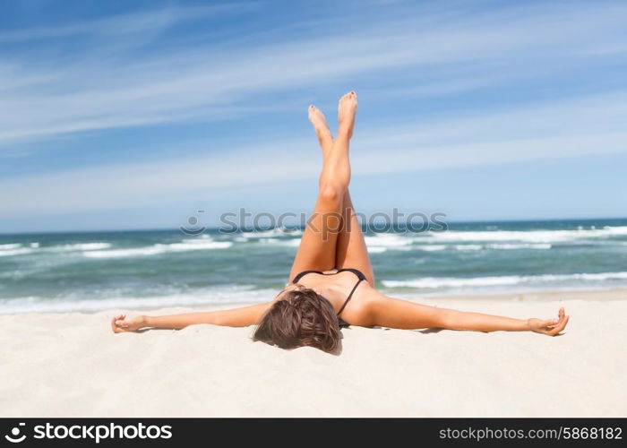 Beautiful young woman relaxing at the beach