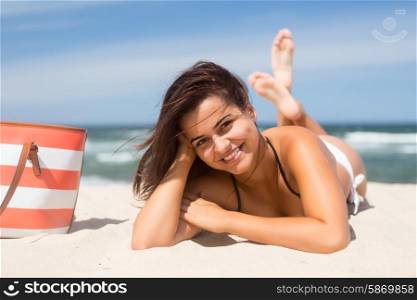 Beautiful young woman relaxing at the beach