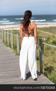 Beautiful young woman relaxing at the beach