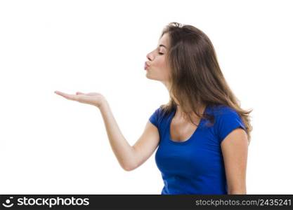 Beautiful young woman sending a kiss, isolated over a white background