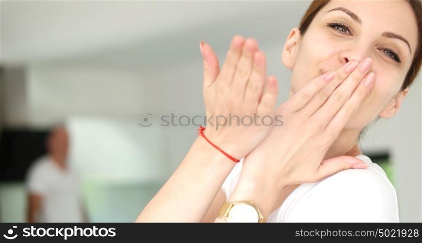 Beautiful Young Woman Sending Air Kiss To Camera