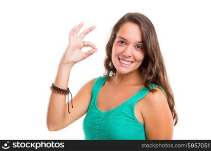 Beautiful young woman signaling ok, isolated over white