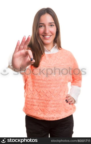 Beautiful young woman signaling ok, isolated over white