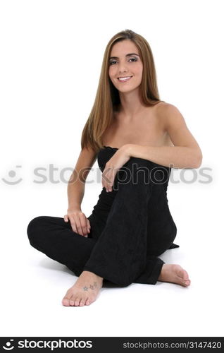 Beautiful Young Woman Sitting On Floor.