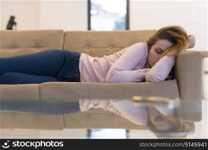 Beautiful Young Woman Sleeping On Sofa At Home