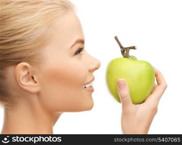 beautiful young woman smelling fresh green apple