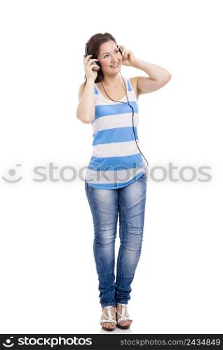 Beautiful young woman smiling and listen music, isolated over white background. Listen Music