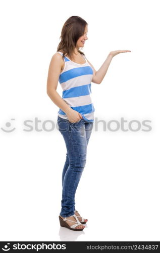 Beautiful young woman smiling and showing something on her hand, isolated over white background