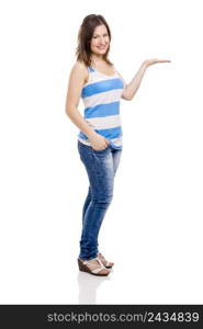 Beautiful young woman smiling and showing something on her hand, isolated over white background