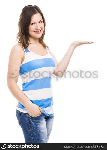 Beautiful young woman smiling and showing something on her hand, isolated over white background