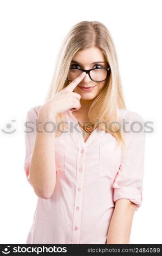 Beautiful young woman smiling and using nerd glasses, isolated over a white background