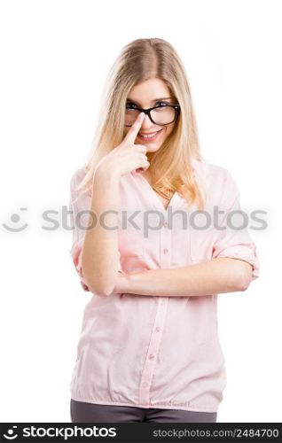 Beautiful young woman smiling and using nerd glasses, isolated over a white background