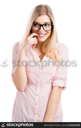 Beautiful young woman smiling with a silly face and using nerd glasses, isolated over a white background