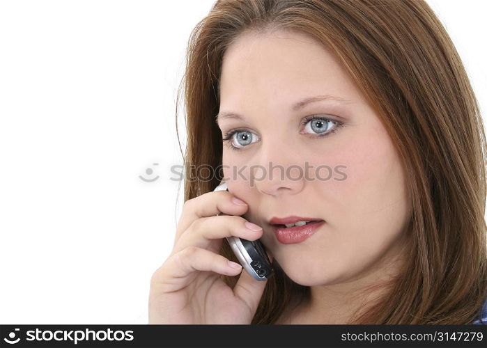 Beautiful young woman speaking on cellphone. Amazing blue eyes and great complextion.