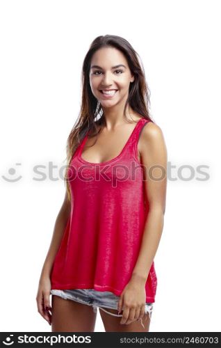 Beautiful young woman standing over a white background