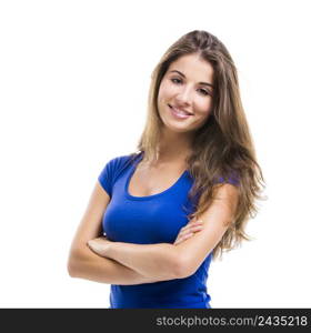 Beautiful young woman standing with arms crossed over a white background