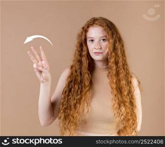 beautiful young woman teaching sign language