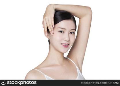 Beautiful young woman touching her head with her hand