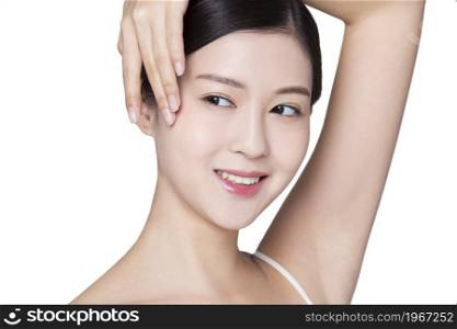 Beautiful young woman touching her head with her hand
