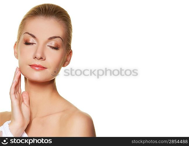 Beautiful young woman touching her skin