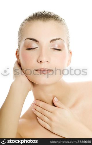 Beautiful young woman touching her skin