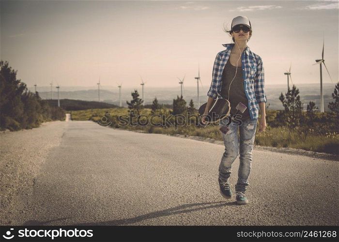 Beautiful Young woman walking her skateboard