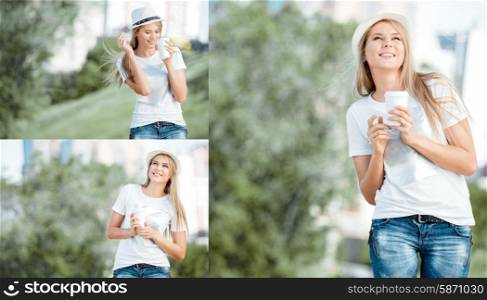 Beautiful young woman walking with a disposable coffee cup, drinking coffee, and smiling against urban nature background.
