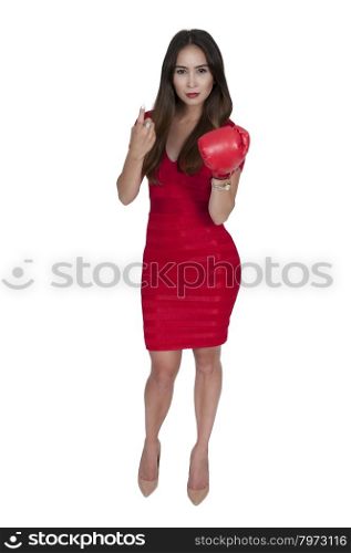 Beautiful young woman wearing a pair of boxing gloves
