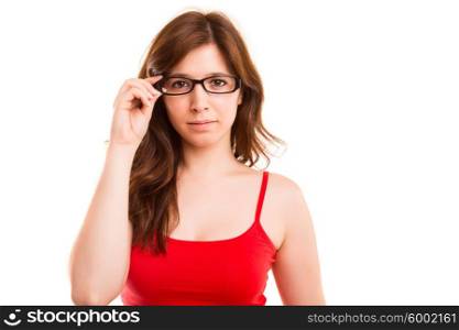 Beautiful young woman wearing glasses, isolated over copy space background