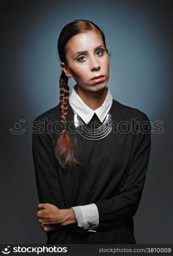 Beautiful young woman wearing pullover and necklace - studio shot