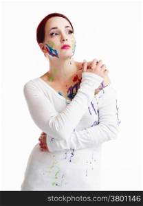 Beautiful young woman wearing white pullover and her face and body are painted, white background