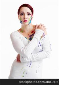 Beautiful young woman wearing white pullover and her face and body are painted, white background
