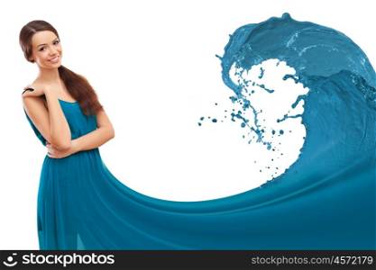 Beautiful young woman with a dress like a wave of colour liquid