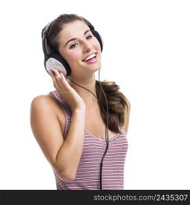 Beautiful young woman with a fresh look listen music, isolated over a white background