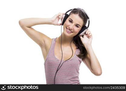 Beautiful young woman with a fresh look listen music, isolated over a white background