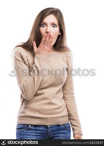 Beautiful young woman with a hand over the mouth astonished with something, isolated over white background