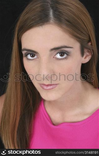 Beautiful Young Woman with Big Brown Eyes and Long Brown Hair. Shot in studio over black with the Canon 20D.