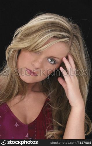 Beautiful Young Woman With Blonde Hair And Hazel Eyes. Shot in studio over black with the Canon 20D.