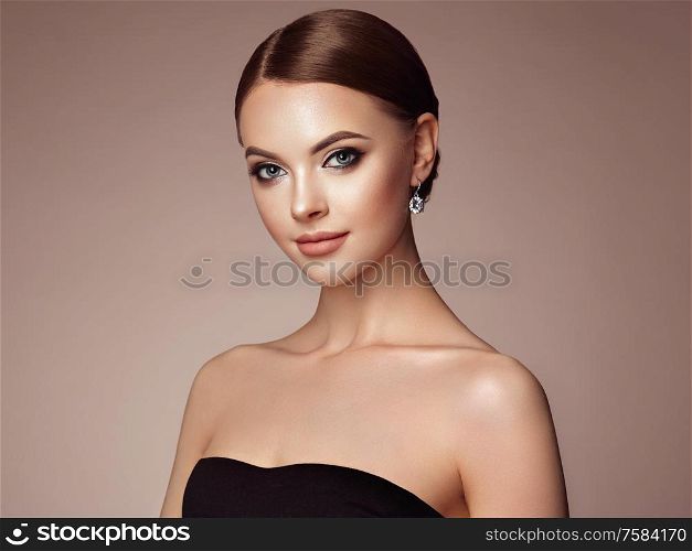 Beautiful Young Woman with Clean Fresh Skin. Perfect Makeup. Beauty Fashion. Eyelashes. Cosmetic Eyeshadow. Highlighting. Cosmetology, Beauty and Spa