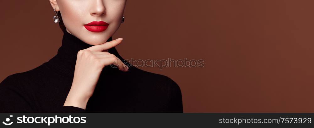 Beautiful Young Woman with Clean Fresh Skin. Perfect Makeup. Beauty Fashion. Red Lips. Cosmetic Eyeshadow. Girl in Black Turtleneck