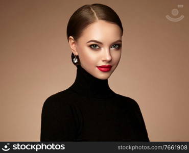 Beautiful Young Woman with Clean Fresh Skin. Perfect Makeup. Beauty Fashion. Red Lips. Cosmetic Eyeshadow. Smooth Hair. Girl in Black Turtleneck